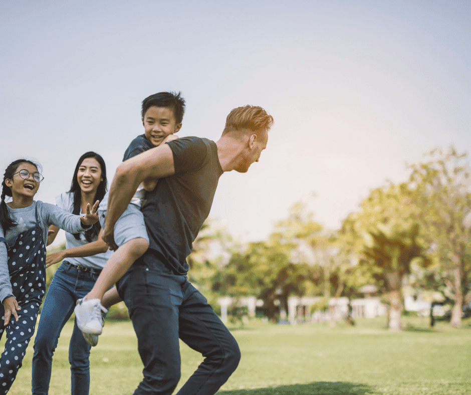 family playing at the park